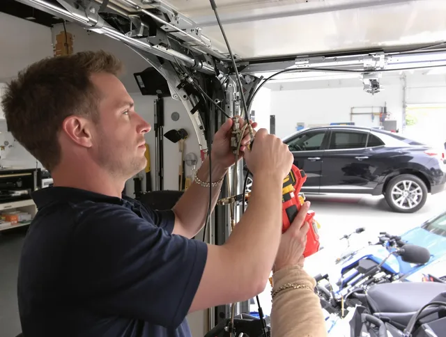 Monterey Park Garage Door Repair safety certified technician performing cable replacement in Monterey Park